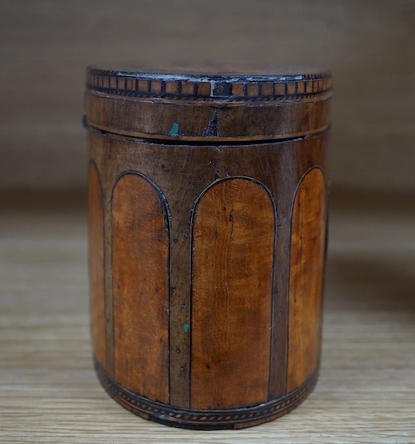 A George III oval satinwood and mahogany tea caddy, 15cm wide. Condition - poor